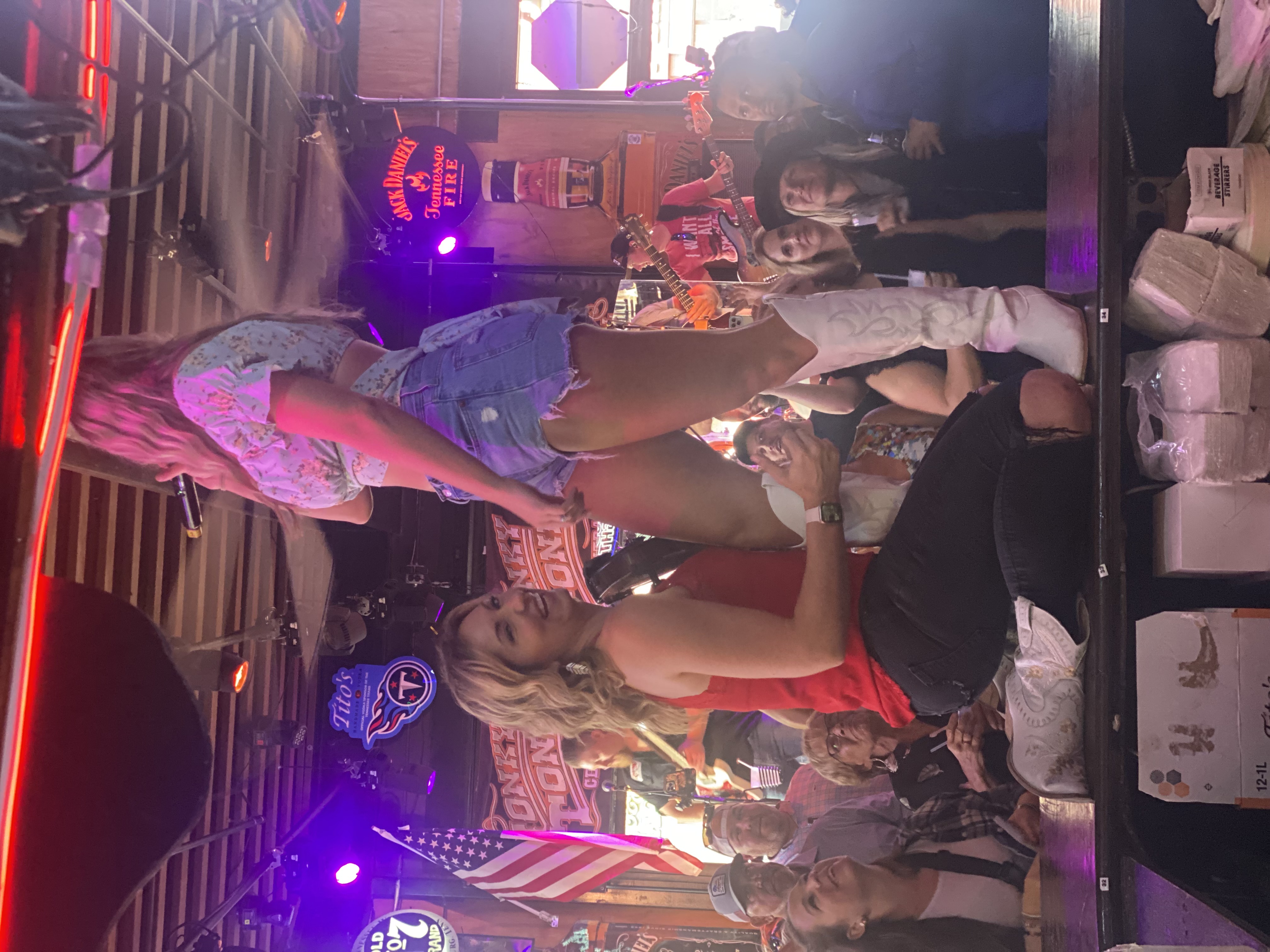 A live band performing on stage at Nashvilla to a crowd